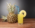 Raw whole pineapple on wooden surface table Royalty Free Stock Photo