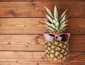 Raw whole pineapple on wooden surface table Royalty Free Stock Photo