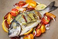 Raw whole sea bream fish and vegetables ingredients Royalty Free Stock Photo