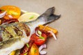 Raw whole sea bream fish and vegetables ingredients Royalty Free Stock Photo