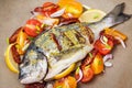 Raw whole sea bream fish and vegetables ingredients Royalty Free Stock Photo