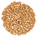 Raw wholegrain green buckwheat in round shape, isolated