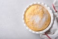 Raw yeast dough with pumpkin in white bowl covered with towel on the floured kitchen table, recipe idea. Concept home baking bread Royalty Free Stock Photo