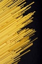 Raw flat spaghetti on black background Royalty Free Stock Photo