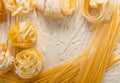 Raw yellow italian pasta pappardelle, fettuccine or tagliatelle Royalty Free Stock Photo