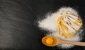 Raw yellow italian pasta pappardelle, fettuccine or tagliatelle