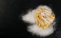 Raw yellow italian pasta pappardelle, fettuccine or tagliatelle