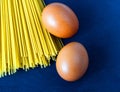 Raw yellow italian spagetti close up with eggs Royalty Free Stock Photo