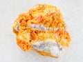 raw yellow Orpiment crystals on white dolomite