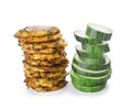 Raw zucchini slices and pancakes on white background Royalty Free Stock Photo