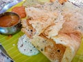 Rawa dosa sambhar with coconut chutney served on banana leaf south indian dish Royalty Free Stock Photo