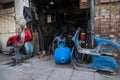 . A mechanic is rebuilding his workshop Vespa scooter Royalty Free Stock Photo