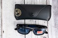 Ray Ban sunglasses and leather glasses case with brand logo Royalty Free Stock Photo