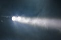 Ray of double pocket flashlight in smoke, copy-space background Royalty Free Stock Photo