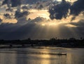 A ray of sunlight breaking through dark clouds