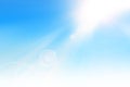 Ray of sunshine in the blue sky with lens flare Royalty Free Stock Photo