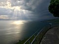 Ray of sunshine piercing through heavy clouds on the lake LÃÂ©man