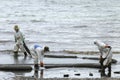 A Worker in biohazard suits used Oil Containment boom as cleani Royalty Free Stock Photo