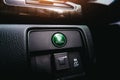 Rayong,Thailand - 30 June 2022 Econ mode button with a green on dashboard of Honda car