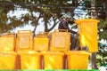 RAYONG, THAILAND-OCTOBER 15 2017: stack of yellow waste bins at public park