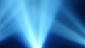 Rays of blue light from searchlights on a black smoke background