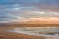 Rays of golden evening light falling on the Plettenberg Bay beach at sunset. Garden Route, Western