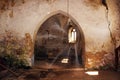 Rays of light in abandoned gothic church