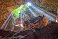 Rays of light entering cave Royalty Free Stock Photo
