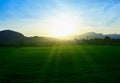 Rays of light on the green fields Royalty Free Stock Photo