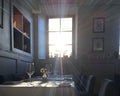 The sun shines through the window onto the table