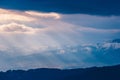 Rays of light pass through the clouds