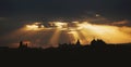 Rays of light shining through dark clouds over Jerusalem city. Christian Religion concept background