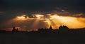 Rays of light shining through dark clouds over Jerusalem city. Christian Religion concept background