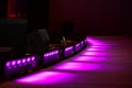 Rays of purple spotlights illuminate the scene Royalty Free Stock Photo