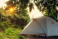 Rays of the rising sun illuminates the tent