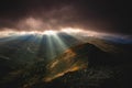 Rays of the setting sun illuminate the mountainous landscape of Tatra mountains, Poland. Royalty Free Stock Photo