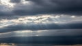 Dramatic Dark Storm Clouds with Sunbeams Breaking Through in a Sky Keywords: sky, clouds, storm, dark, dramatic Royalty Free Stock Photo