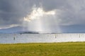 Rays of the sun from behind the clouds over the ocean Royalty Free Stock Photo