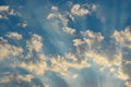 Rays of the sun on a blue sky with clouds Royalty Free Stock Photo