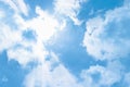 The rays of the sun break through the clouds, a clear blue sunny sky. Cloudscape Background Backdrop Royalty Free Stock Photo