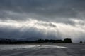 Rays of sun between the clouds on Ladeira Beach in Baiona Royalty Free Stock Photo