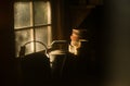Rays of the sun in the dirty window of an abandoned house. Inside view. Household items on the table. soft tone Royalty Free Stock Photo