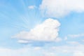 rays of the sun shine over the cloud against the blue sky. blue sky with big cloud close up Royalty Free Stock Photo