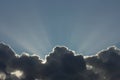 Rays of the sun shine over dark clouds Royalty Free Stock Photo