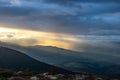 Rays of the sun at sunset in the mountains Royalty Free Stock Photo