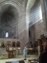 Rays of sunlight penetrating the interior of an ancient Georgian Orthodox church.