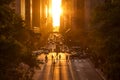 Rays of sunlight shining down on the people and traffic in Midtown Manhattan, New