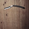 Razor of barber shop on the wood background Royalty Free Stock Photo