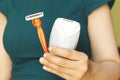 Razor or shaver and epilator in woman hand. Electric vs manual shave