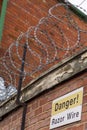 Razor wire, keeping people out and others in